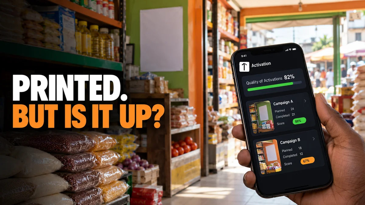Photograph of a Lagos provision store shelf with a promotional poster and shelf strips, a hand holding a phone showing a campaign activation screen, and the headline Printed, But Is It Up.